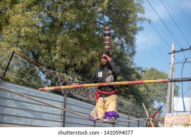 New Delhi, India - March 16 2019: A Girl Walking On Tight Rope In City Street.