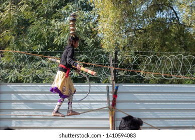 New Delhi, India - March 16 2019: A Girl Walking On Tight Rope In City Street.