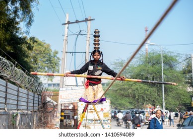 New Delhi, India - March 16 2019: A Girl Walking On Tight Rope In City Street.