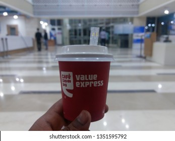 NEW DELHI, INDIA - March 25, 2019 : Cafe Coffee Day Coffee With Little Straw Pipe In Hand