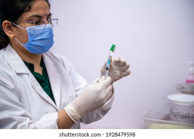 New Delhi, India, March 3 2021: A Healthcare Worker Preparing A Syringe With Covid-19 Vaccine During The Second Phase Of Covid-19 Vaccination Drive.