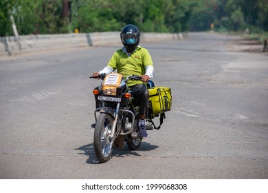 New Delhi, India- May 1 2021: A BigBasket Delivery Boy With Food Order,  Amid Covid  Lockdown In India, Emergency Services During Pandemic.