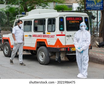 New Delhi, India, May 18 2021: Ambulance Driver In PPE Kit Waiting Outside Of Maulana Azad Medical College Mortuary,