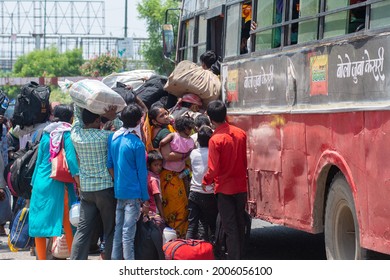 New Delhi, India- May 19 2020: Migrant Labour Catching Bus  At Near Anand Vihar Bus Terminal During Nation Wide Lockdown In India. They Are Jobless, Temporary Work Closed Due To Lockdown