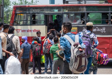 New Delhi, India- May 19 2020: Migrant Labor Board The Bus Near Anand Vihar Bus Terminal, Indian Migrant Workers During COVID 19 Corona Virus Nationwide Lockdown Returning Back Home Via Special Bus.