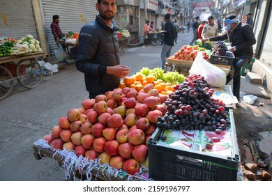 New Delhi, India - May 2022 : Indian Street Vendor With Fresh Fruits In Delhi.