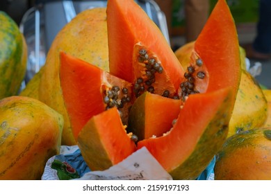 New Delhi, India - May 2022 : Indian Street Vendor With Fresh Fruit Papaya  In Delhi.