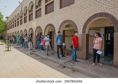 New Delhi, India, May 3 2021: vaccination in India, young people in queue for covid-19 vaccine shot, Third phase Of Covid-19 Mass Vaccination Drive For People Above 18 Begins In Delhi, India. 
