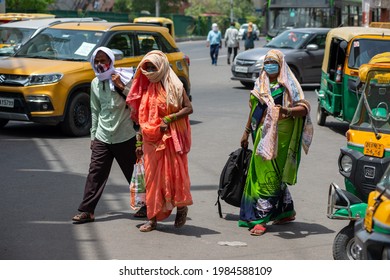 New Delhi, India, May 31 2021: Indian Lower Middle Class  Family Searching Auto Rickshaw Near Anand Vihar Bus Terminal, Returning From Rural Area To Urban Area.