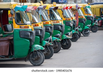 New Delhi, India, May 31 2021: Row Of Auto Rickshaw Parked On The Road Side Of The Street Waiting For Passenger At Anand Vihar Bus Terminal.