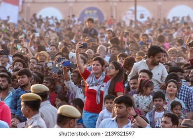 New Delhi, India- Nov 8 2019: Indian girls are excited while recording movement with the help of Mobile during Dussehra ceremony on Vijayadashami at Dwarka Ramleela Ground