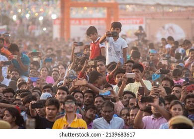New Delhi, India- Nov 8 2019: crowd of people are excited while recording movement with the help of Mobile during Dussehra ceremony on Vijayadashami at Dwarka Ramleela Ground