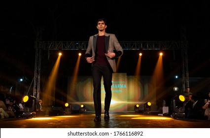 NEW DELHI, INDIA - NOVEMBER 2019 : Young Indian Male Walking On Stage With Designer Dresses In A Fashion Show