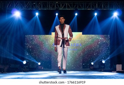 NEW DELHI, INDIA - NOVEMBER 2019 : Young Indian Male Walking On Stage With Designer Dresses In A Fashion Show