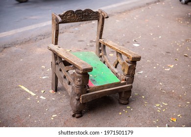 New Delhi, India, October 18 2019:   Vintage Arm Wooden Chair Kept On Roadside. 