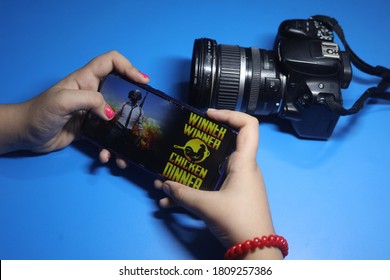 NEW DELHI, INDIA - September 05, 2020: A Child Playing PUBG Mobile Battle Royal Game On Her Android Smart Phone 
