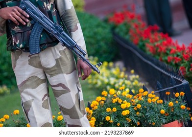 New Delhi, India-16 March 2012: Soldier Of Indian Paramilitary Force On Duty Near Flower Bed