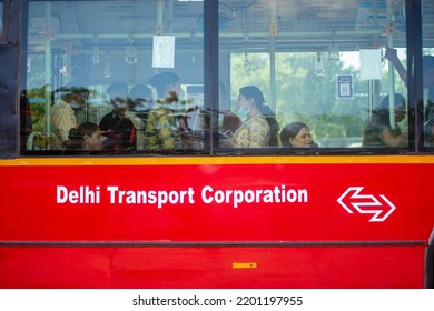 New Delhi, India-Aug 23 2022: Women Travelling In DTC Red Colored Air Condition Bus 