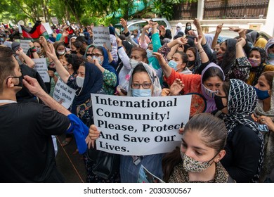 New Delhi, India-Aug 24 2021: Afghan Women Holding Placards And Shouting Slogans,  Afghans Living In India Gathered At UNHCR To Protest And Demanding To Be Given Refugee Status In India.