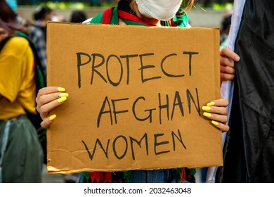 New Delhi, India-Aug 24 2021: Afghan Student Crying While Protesting With Placards Against The Taliban Demanding Protect Afghan Women, Protest Organised By National Federation Of Indian Women