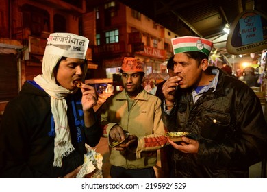 New Delhi, India-Feb 2 2015:  BJP Party Worker, Congress Party Worker And Aam Aadmi Party Worker Eating Sweets Together During The Delhi Assembly Election 2015