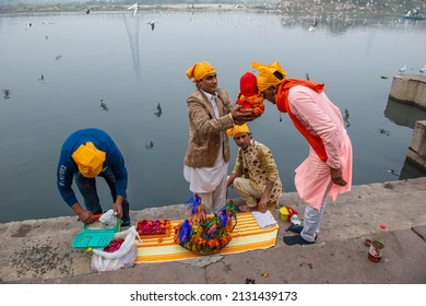 New Delhi, India-Feb 2 2022: Sindhi Hindus followers of Jhulelal holding worship items come at   yamuna river near kashmiri gate. for worship god varuna.