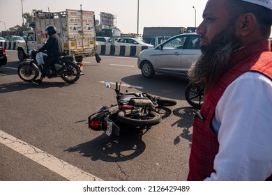 New Delhi, India-Feb 20 2022: Car And Motorcycle Accident At Delhi Meerut Expressway Due To Overspeeding. Motorcycle Hit By Overspeed Car. People Helping To Road Accident Victims