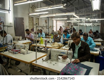 New Delhi, India-Feb 22 2017:  Indian Workers Sew In Clothing Factory In Delhi. Post-processed With Grain, Texture And Color Effect.