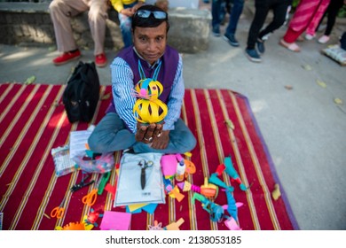 New Delhi, India-Feb 27 2022: Artist Showing Beautiful Cat Toy, Made By Paper, 