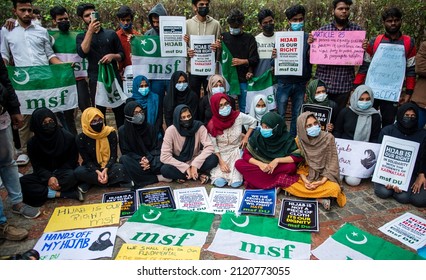 New Delhi, India-Feb 9 2022: Muslim Student Federation (MSF) member holds a placard as she participates in a protest against the recent hijab ban in some high schools and colleges of Karnataka