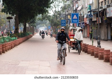 New Delhi, India-Jan 16 2022: A Cyclist On Deserted Chandni Chowk Road During An Ongoing Weekend Curfew In The Old Delhi