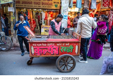 New Delhi, India-Jan 28 2022: People Buying And Eating Kulfi (ice Cream) From Traditional And Old Style Tricycle Rickshaw Shop On The Street Of Nai Sarak, Food Stall In Chandni Chowk Old Delhi