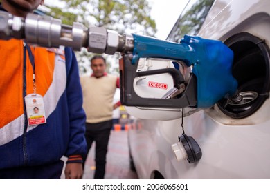 New Delhi, India-January 15 2020: Man Customer Attendant Filling Diesel In Car Tank At The Indian Oil Petrol Pump