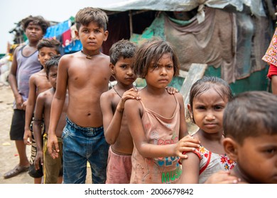 New Delhi, India-July 11 2021: Group Of Poor Children Standing In Queue For Food In Slum Area Near New Usmanpur In New Delhi, Close To 9.97 Crore Children In India Live In Poverty Stricken Conditions.