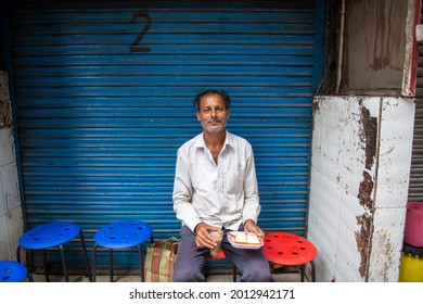 New Delhi, India-July 22 2021: Man Eating Bread Butter With Tea In Old Delhi, During Eid Al Adha Festival Bazar Matia Mahal Near Jama Masjid In Old Delhi.