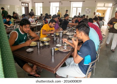 New Delhi, India-July 26 2021: group of students eating together in Hostel dining room of hindu college in delhi india.