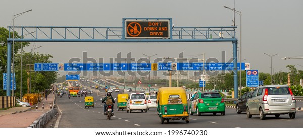 New Delhi, India-June 15 2021: Digital display\
board showing warning dont drink and drive,  blue signboard on a\
national highway nine in\
delhi.