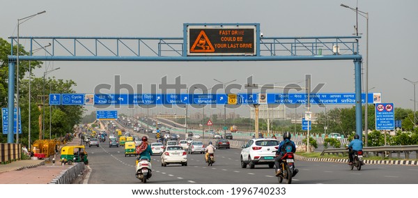 New Delhi, India-June 15 2021:
Digital display board showing warning, Fast Drive could be your
Last Drive,  blue signboard on a national highway nine in
delhi.
