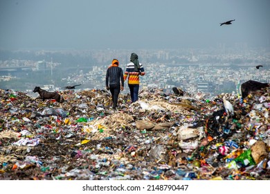 New Delhi, India-March 29 2022: garbage picker searching valuables at Ghazipur Landfill site 