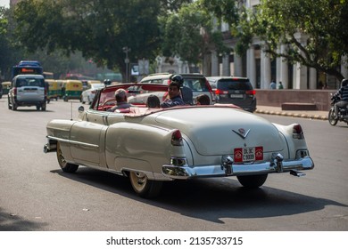 New Delhi, India-March 6 2022: Antique Vintage Cadillac Car On Road Of Connaught Place Outer Circle During Traffic.