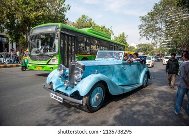 New Delhi, India-March 6 2022: Antique Vintage Rolls Royce Car On Road Of Connaught Place During Traffic.