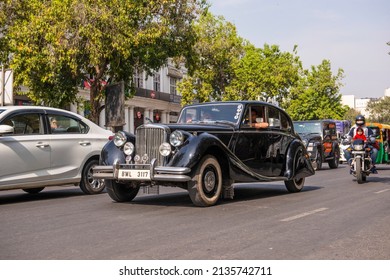 New Delhi, India-March 6 2022: Antique Vintage Jaguar Car On Road Of Connaught Place During Traffic.