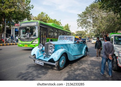 New Delhi, India-March 6 2022: Antique Vintage Rolls Royce Car On Road Of Connaught Place During Traffic.