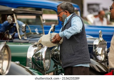 New Delhi, India-March 6 2022: A Man Pouring Petrol In Antique Vintage Car.