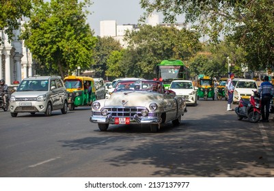 New Delhi, India-March 6 2022: Antique Vintage Cadillac Car On Road Of Connaught Place Outer Circle During Traffic.