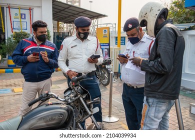 New Delhi, India-Nov 19 2021: Delhi Traffic Police And Government Volunteer Checking Pollution Certificate And Making Challan At Petrol Pump.