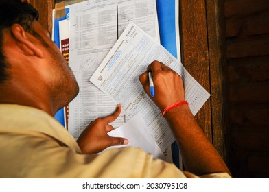 New Delhi, India-Sep 1 2019: Student Filling Admission Form And Submitting It At Window Of Indira Gandhi National Open University (IGNOU), Central Open Learning University Located In Delhi.