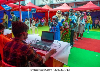 New Delhi, India-Sep 29 2021: Men And Women In Queue At Registration Desk At Free Covid Vaccination Camp.  Special Vaccination Camp For Slum Dwellers At Anna Nagar Slum Area In Delhi.