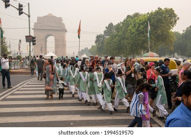 New Delhi, India-September 30 2019: Large Group Of School Students And Foreign Tourist Crossing Road Near India Gate Zebra Crossing. Famous Landmark Of India Tourist Place And Picnic Spot