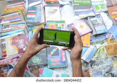 New Delhi/India - 06/14/2019: Shopkeepers Use A Smartphone To Watch The ICC Cricket World Cup Match Between India And Pakisan, In New Delhi.